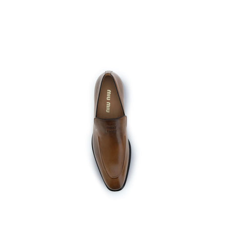 Mocassins à enfiler Miu Miu en cuir de veau marron Bos Taurus