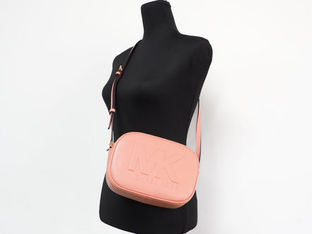 Sac bandoulière appareil photo ovale moyen Michael Kors Jet Set Travel en cuir Sherbert
