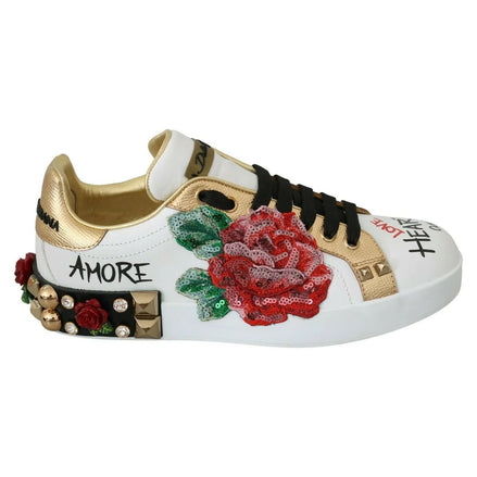 White and gold designer sneaker with sequin red rose embroidery, studs, and black laces