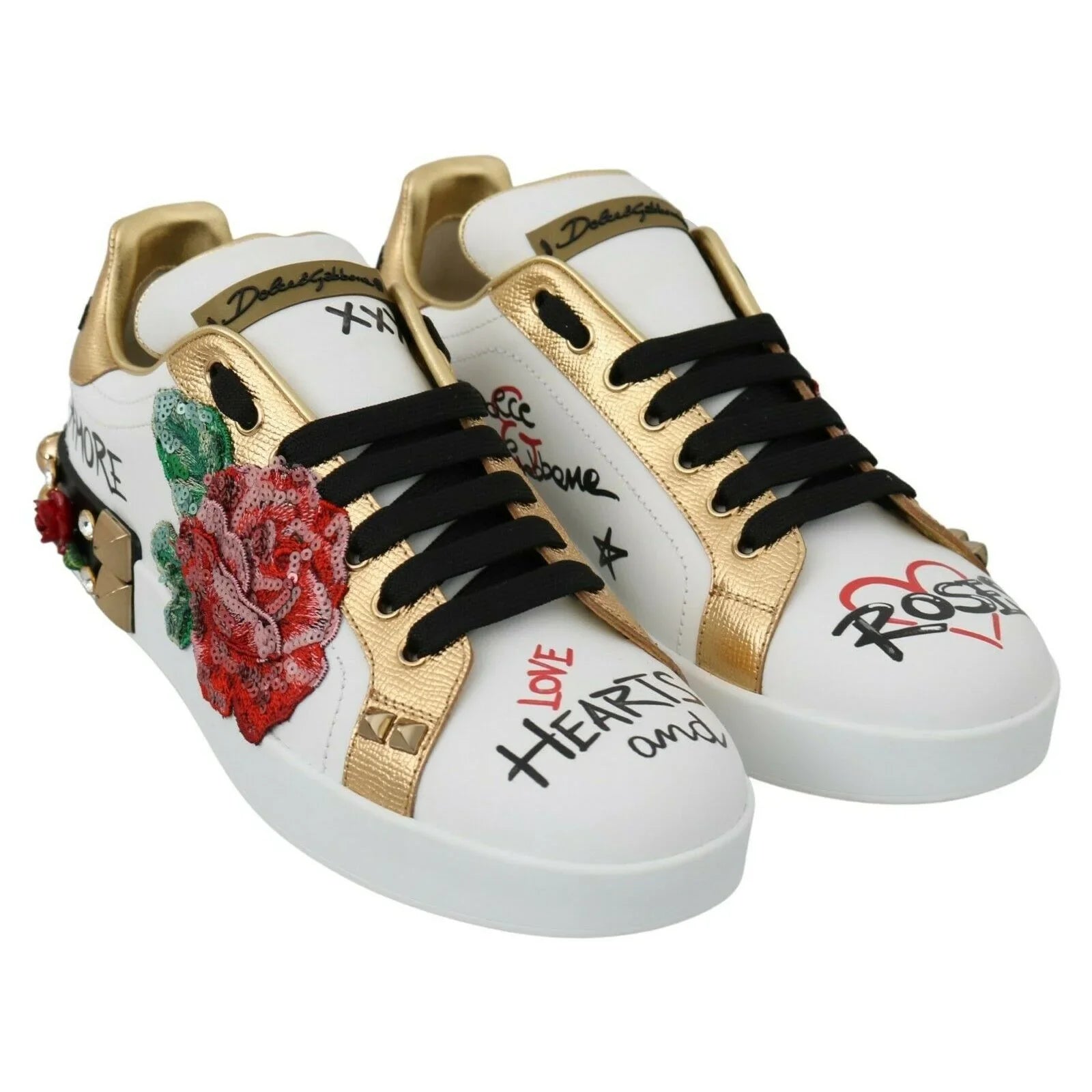 White and gold designer sneakers with embroidered rose, graphic prints, and black laces