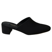 Black mule shoe with low block heel, slip-on design, minimalist women's luxury footwear