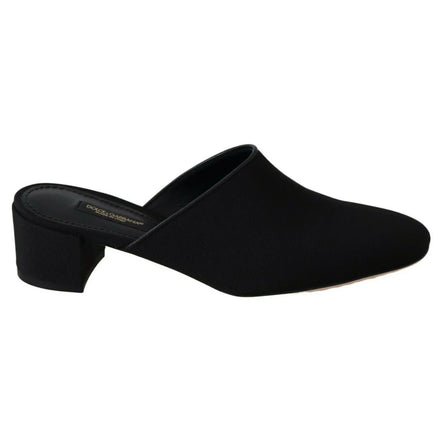 Black mule shoe with low block heel, slip-on design, minimalist women's luxury footwear