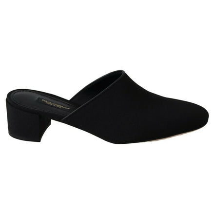 Black mule shoe with low block heel, slip-on design, minimalist women's luxury footwear