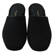 Pair of black Dolce & Gabbana slip-on mule slippers with closed toes, top view