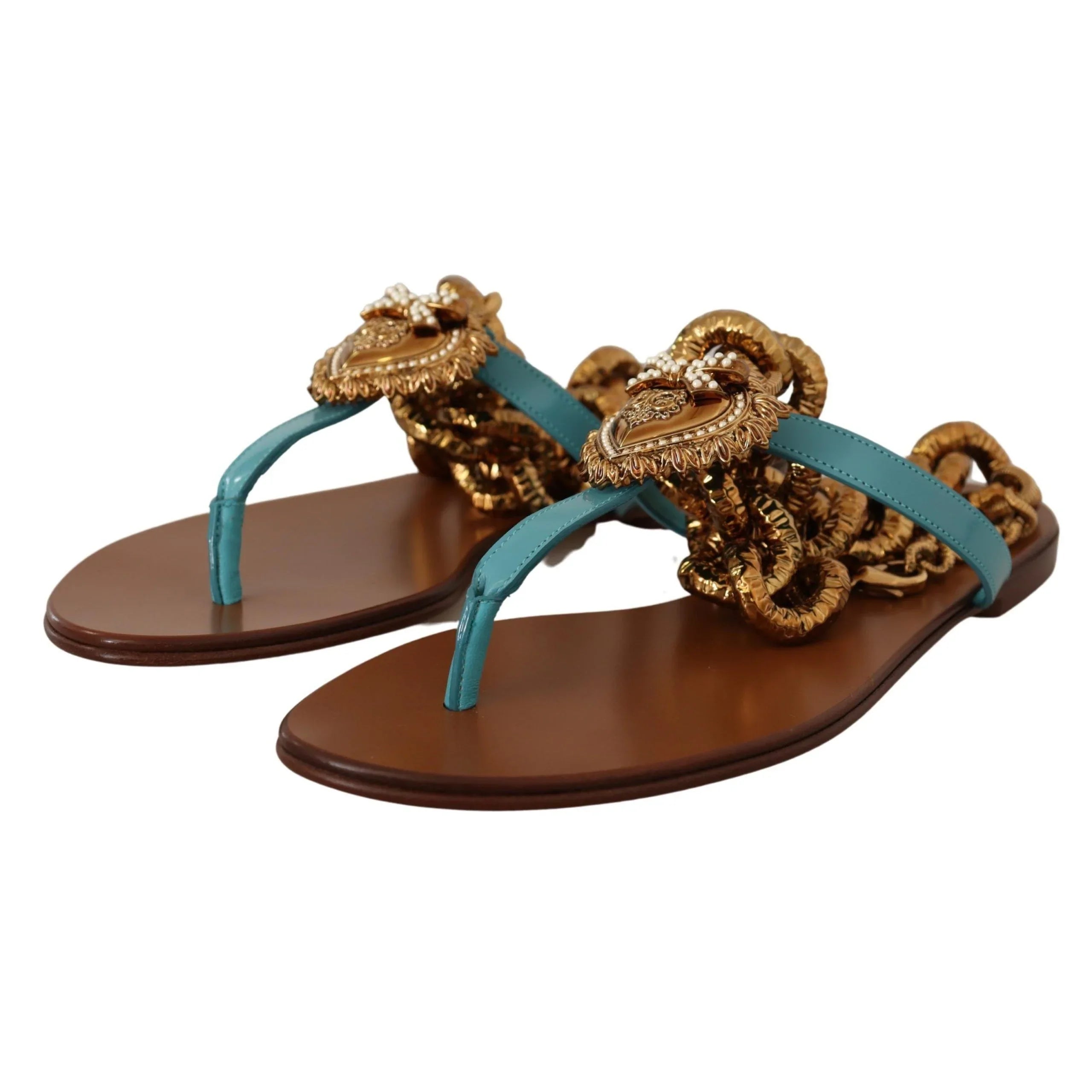 Luxury thong sandals with turquoise leather straps, gold chain details, and medallion accents