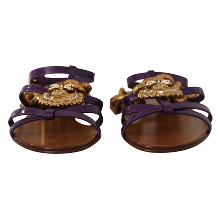 Purple strappy sandals with gold ornate embellishments and brown soles, luxury designer style