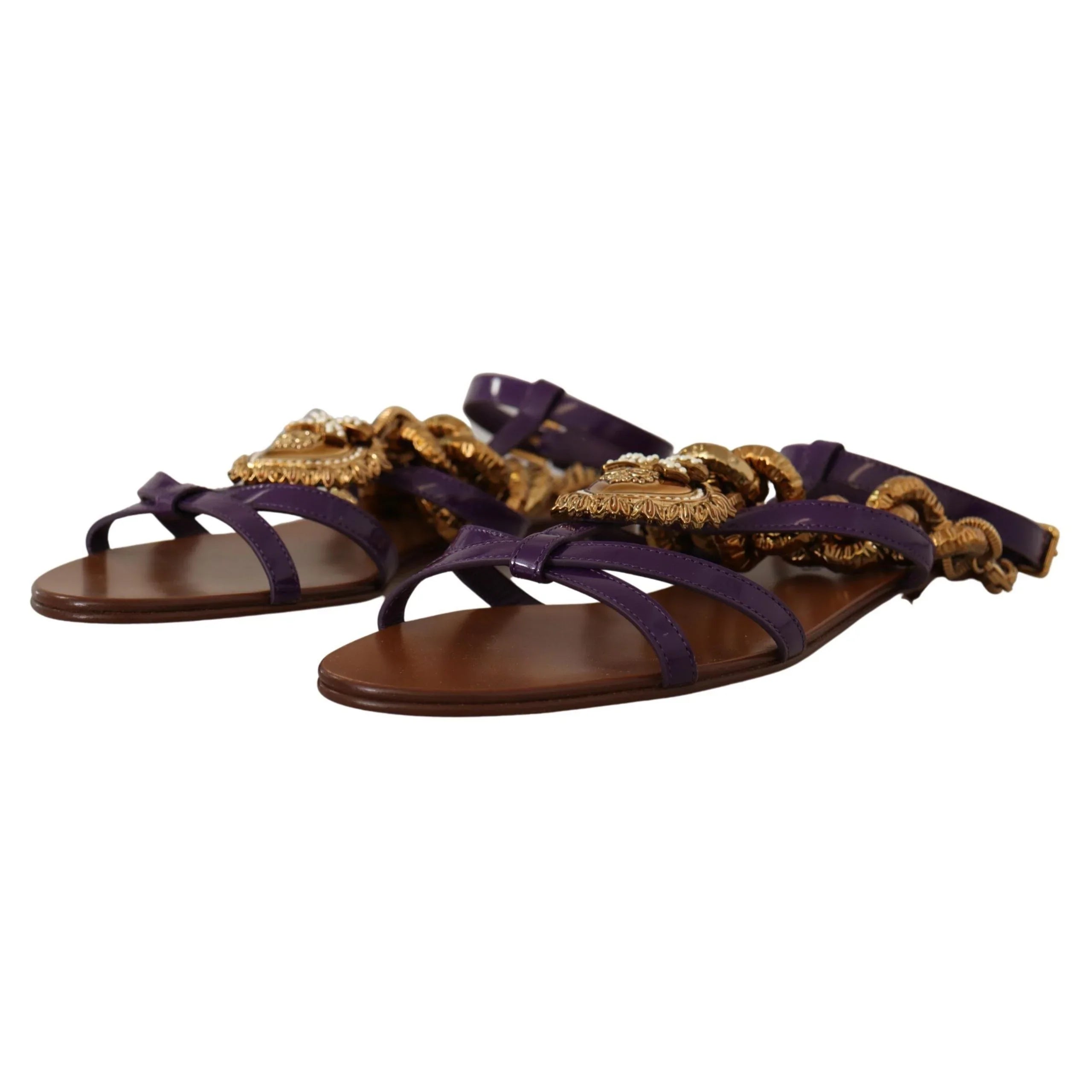 Purple leather flat sandals with gold ornate embellishments and ankle straps