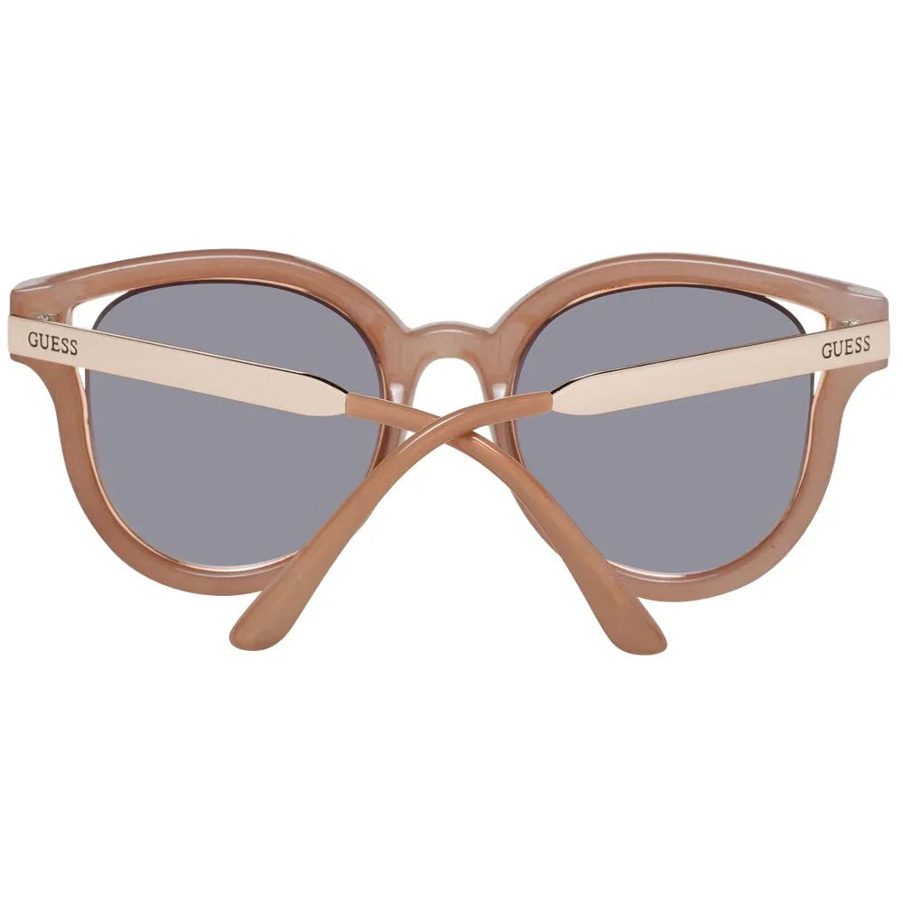 Round beige frame sunglasses with grey lenses and Guess logo on temples