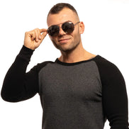 Man in casual textured crew neck sweater wearing aviator sunglasses on white background