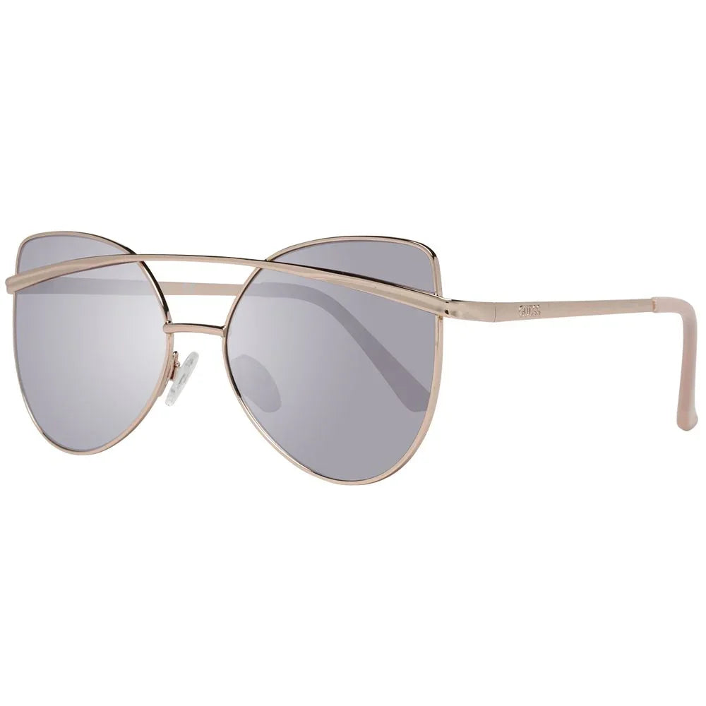 Cat eye sunglasses with gold metal frame and grey tinted lenses, modern designer style