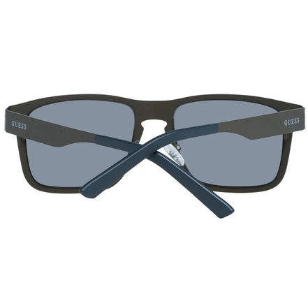 Black rectangular Guess sunglasses with dark lenses, folded arms, front view.