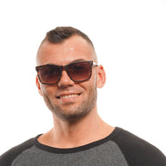 Occhiali da sole Guess in plastica marrone