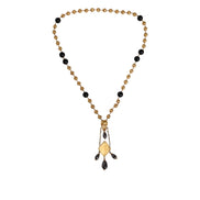 Collana Dolce & Gabbana stile rosario con perline nere e catena in ottone color oro