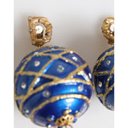 Boucles d'oreilles clips Dolce & Gabbana en laiton doré, boule de Noël bleue et cristaux.