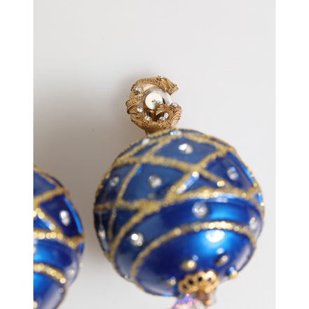 Boucles d'oreilles clips Dolce & Gabbana en laiton doré, boule de Noël bleue et cristaux.