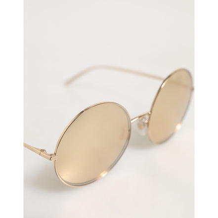 Occhiali da sole Dolce & Gabbana con lenti rotonde in metallo dorato