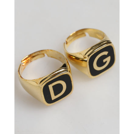 Anelli regolabili Dolce & Gabbana color oro in ottone nero smaltato con logo "DG"