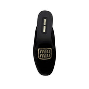 Mules Miu Miu en cuir de veau noir