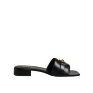 Versace Sandales plates en cuir noir à logo