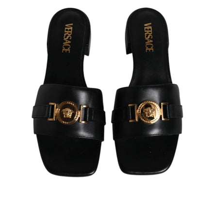 Versace Sandales plates en cuir noir à logo