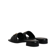 Versace Sandales plates en cuir noir à logo