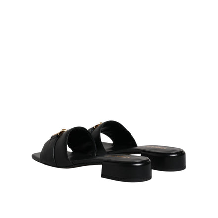 Versace Sandales plates en cuir noir à logo