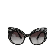 Lunettes de soleil polarisées Dolce & Gabbana avec papillon à sequins noirs et argentés