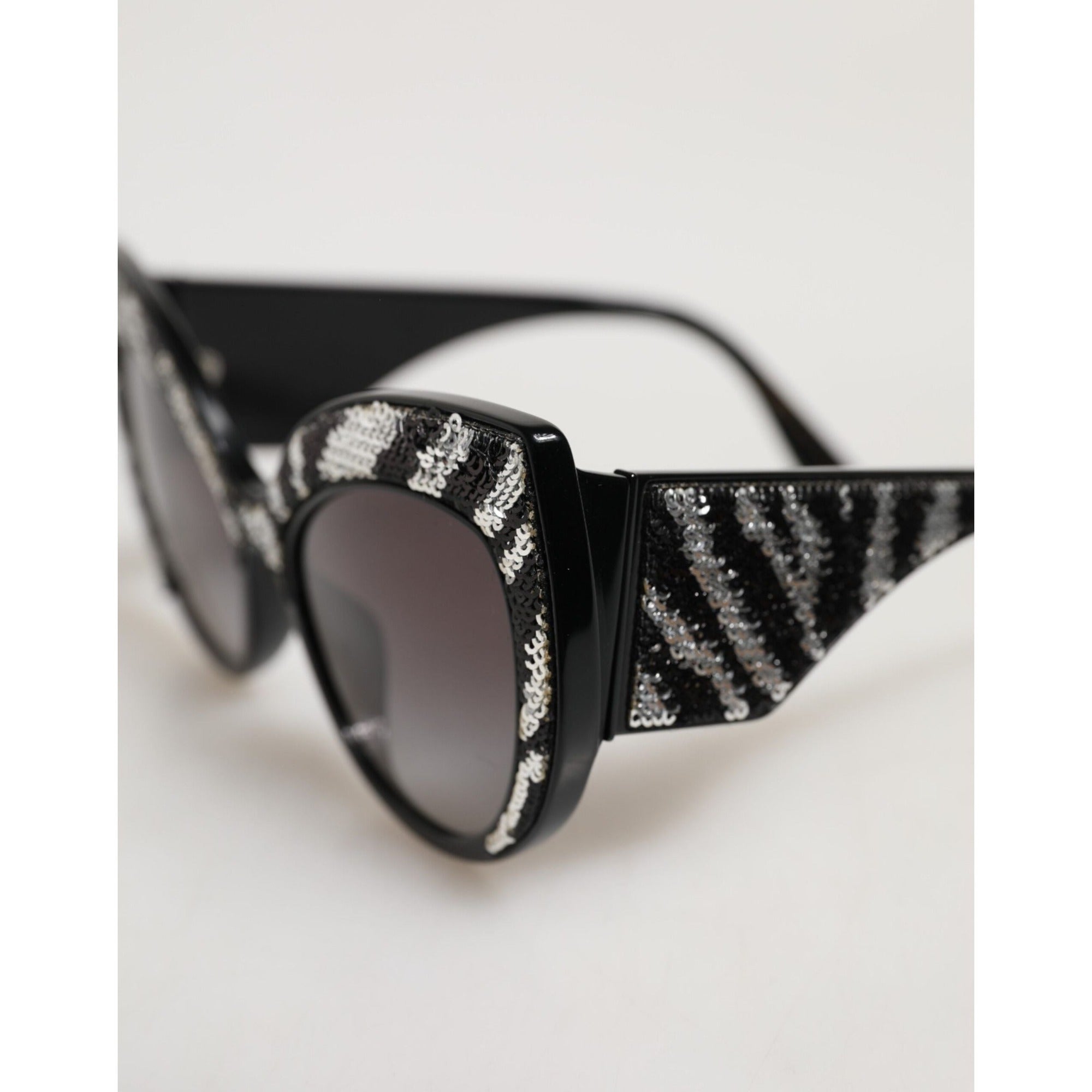 Lunettes de soleil polarisées Dolce & Gabbana avec papillon à sequins noirs et argentés
