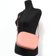 Sac bandoulière appareil photo ovale moyen Michael Kors Jet Set Travel en cuir Sherbert