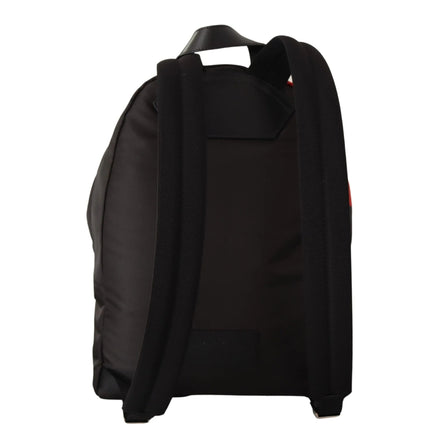 Back view of black designer backpack with padded shoulder straps on white background