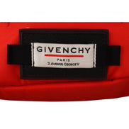 Close-up of Givenchy Paris logo patch on a red designer bag